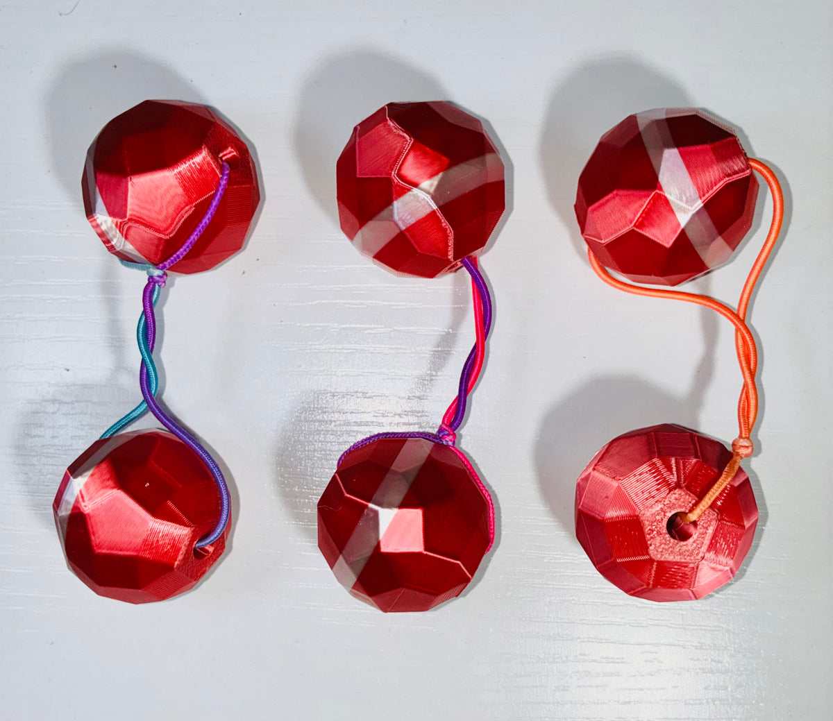 Sphere Ponytail holder (lg)ruby red, lavender, blk.